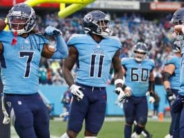 Tennessee Titans win AFC South title by beating Miami Dolphins.