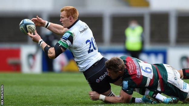 Philip van der Walt of Newcastle Falcons offloads the ball after being tackled by Hanro Liebenberg of Leicester Tigers