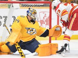 Juuse Saros, Nashville Predators goalie, is out of the game against Calgary Flames because of injury