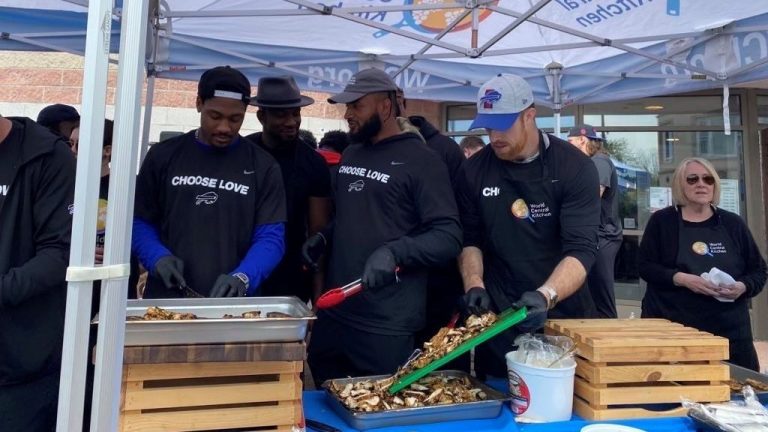 Buffalo Bills coaches and players volunteer their time to help the community after a shooting.
